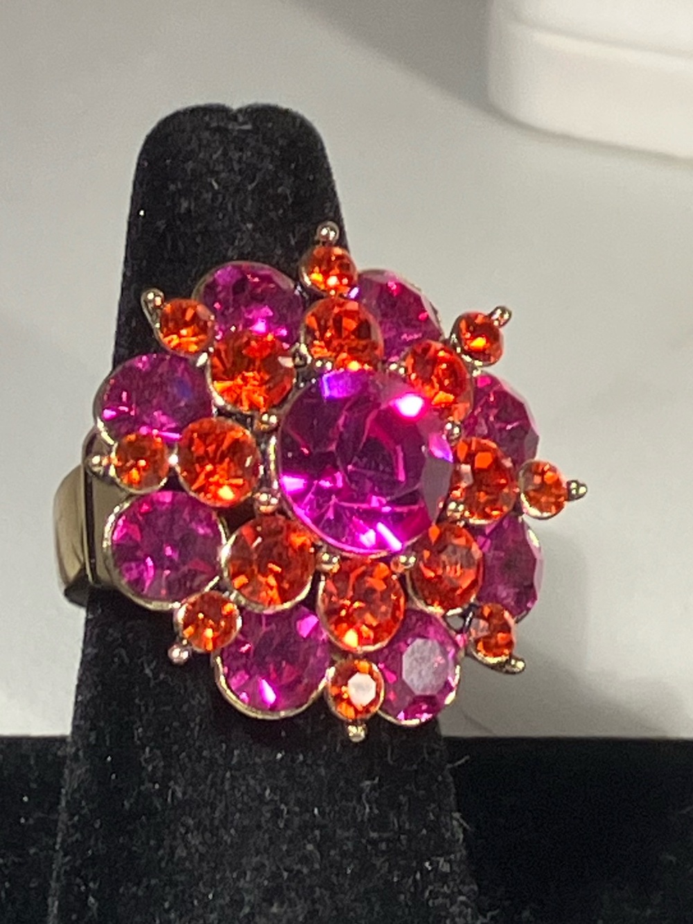 Stunning multi hue pink crystal with an antique gold Tone finish